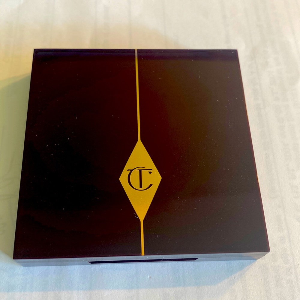 Charlotte Tilbury The Rebel eyeshadow palette. Only swatches once. Never worn.